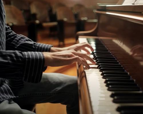 Composer playing the piano